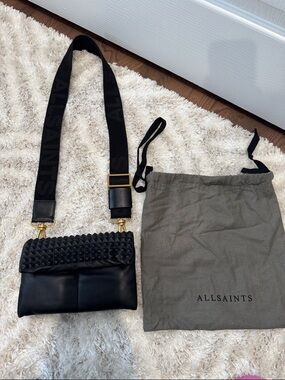 AllSaints Black Leather Ezra Crossbody Bag with Studded Flap and Wide Logo Strap